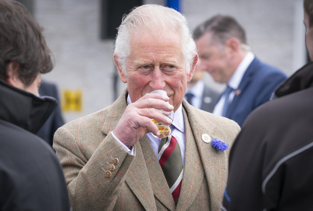 The Prince of Wales has a dram of whisky before officially opening the Lerwick Harbour and Scalloway fish markets (Jane Barlow/PA) (PA Wire)