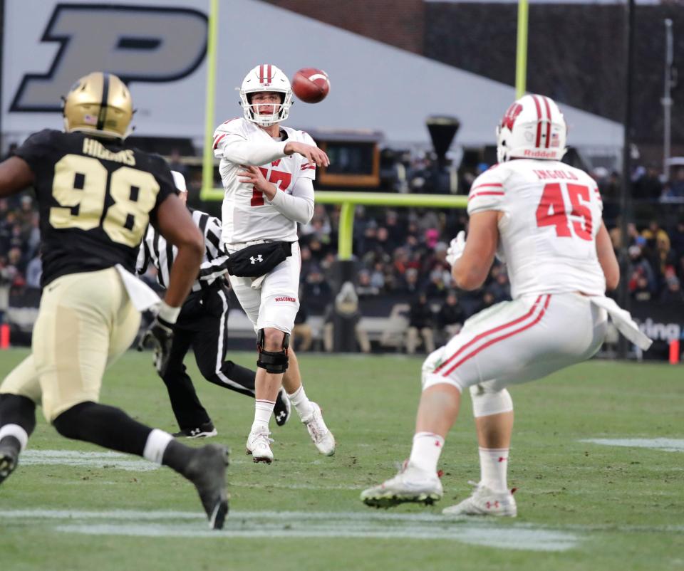 Wisconsin Badgers quarterback Jack Coan throws an incomplete pass to Wisconsin Badgers fullback <a class="link " href="https://sports.yahoo.com/nfl/players/32344" data-i13n="sec:content-canvas;subsec:anchor_text;elm:context_link" data-ylk="slk:Alec Ingold;sec:content-canvas;subsec:anchor_text;elm:context_link;itc:0">Alec Ingold</a> (45) in the red zone during the Wisconsin- Purdue Big 10 football game in West Lafayette, IN, Saturday, November 17, 2018 . RICK WOOD/MILWAUKEE JOURNAL SENTINEL ORG XMIT: 20097204A