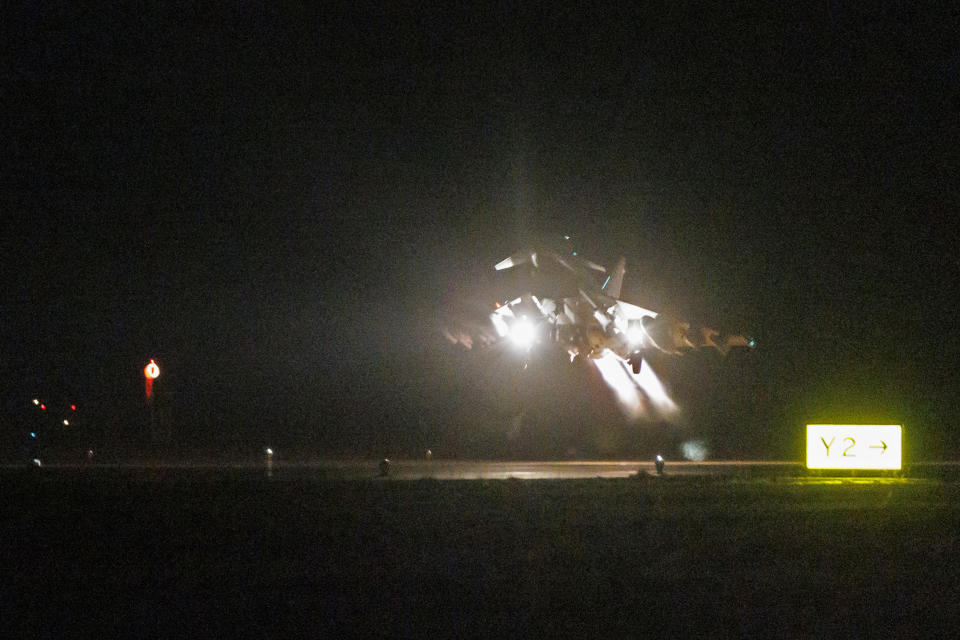 In this image provided the Ministry of Defence, an RAF Typhoon aircraft takes off to conduct further strikes against Houthi military targets in Yemen, from RAF Akrotiri, Cyprus, Saturday, Feb. 3, 2024. (AS1 Jake Green/Ministry of Defence via AP)