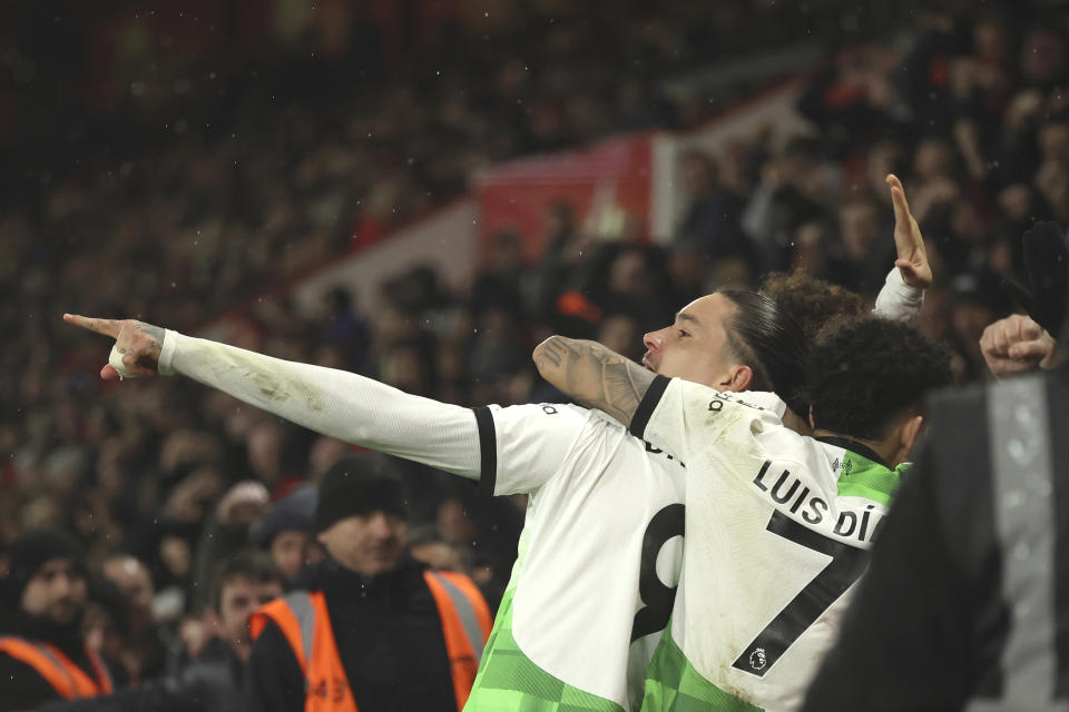 Liverpool's Darwin Nunez, centre, celebrates after scoring his side's opening goal during the English Premier League soccer match between AFC Bournemouth and Liverpool at the Vitality Stadium, in Bournemouth, England, Sunday, Jan. 21, 2024. (AP Photo/Ian Walton)