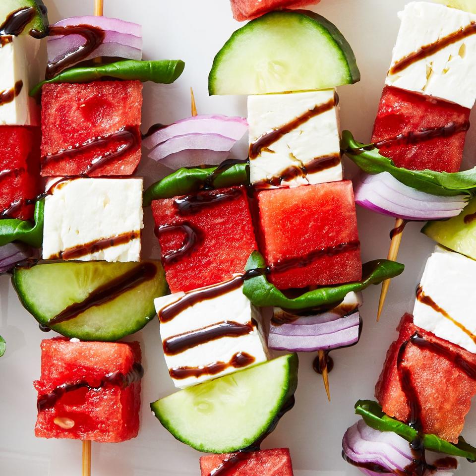 skewers with watermelon, feta, cucumber, basil, and red onion drizzled with a balsamic glaze