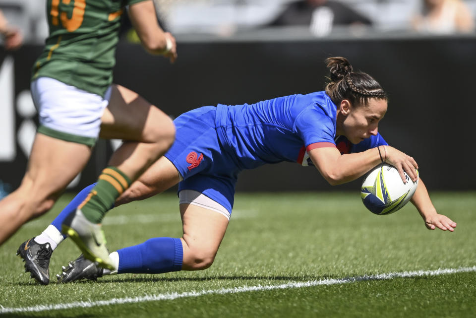 Laure Sansus of France scores a try during the Women's Rugby World Cup pool match between South Africa and France, at Eden Park, Auckland, New Zealand, Saturday, Oct.8. 2022. (Andrew Cornaga/Photosport via AP)