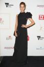 <p>Fox Sports reporter Lara Pitt dazzled in this black one shoulder gown with a high turtleneck and matching clutch.</p>