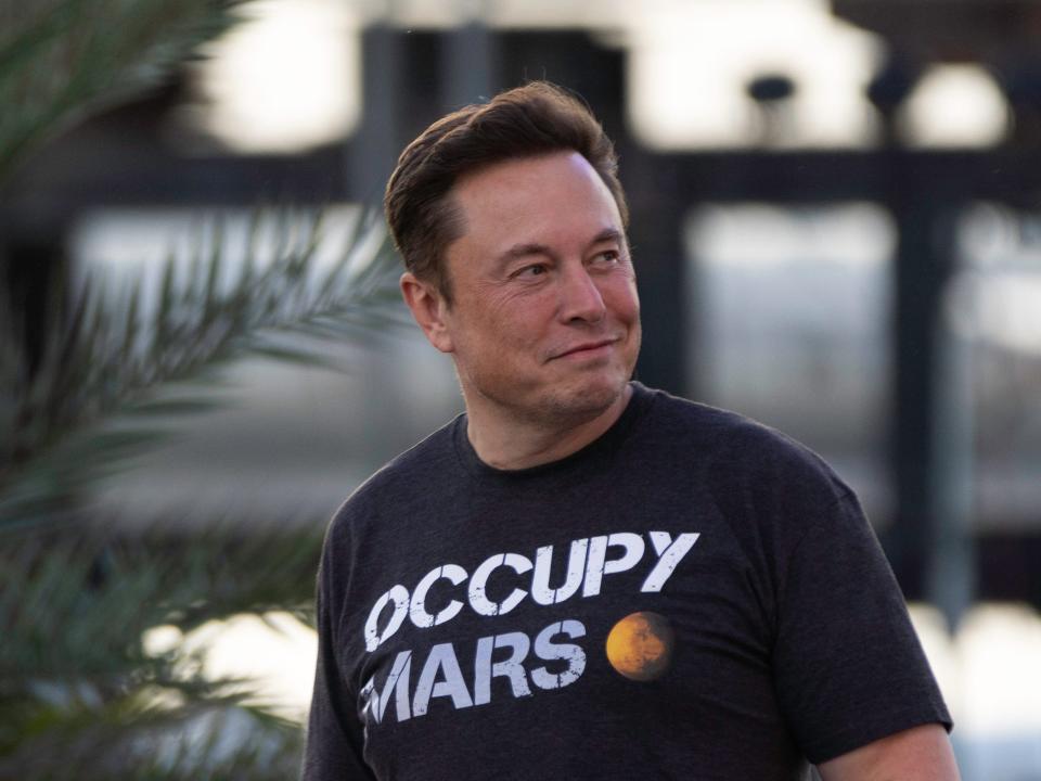 SpaceX founder Elon Musk walks on stage during a T-Mobile and SpaceX joint event on August 25, 2022 in Boca Chica Beach, Texas