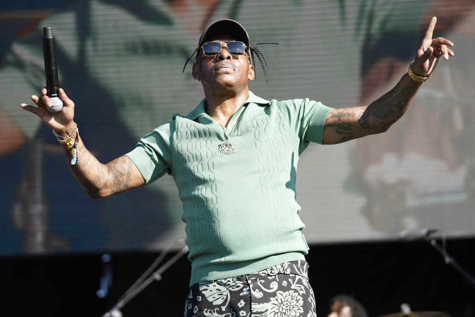 FILE - Coolio performs on day three of Riot Fest on Sept. 18, 2022, at Douglass Park in Chicago. Coolio, the rapper who was among hip-hop's biggest names of the 1990s with hits including “Gangsta's Paradise” and “Fantastic Voyage,” died Wednesday, Sept. 28, 2022, at age 59, his manager said. (Photo by Rob Grabowski/Invision/AP, File)