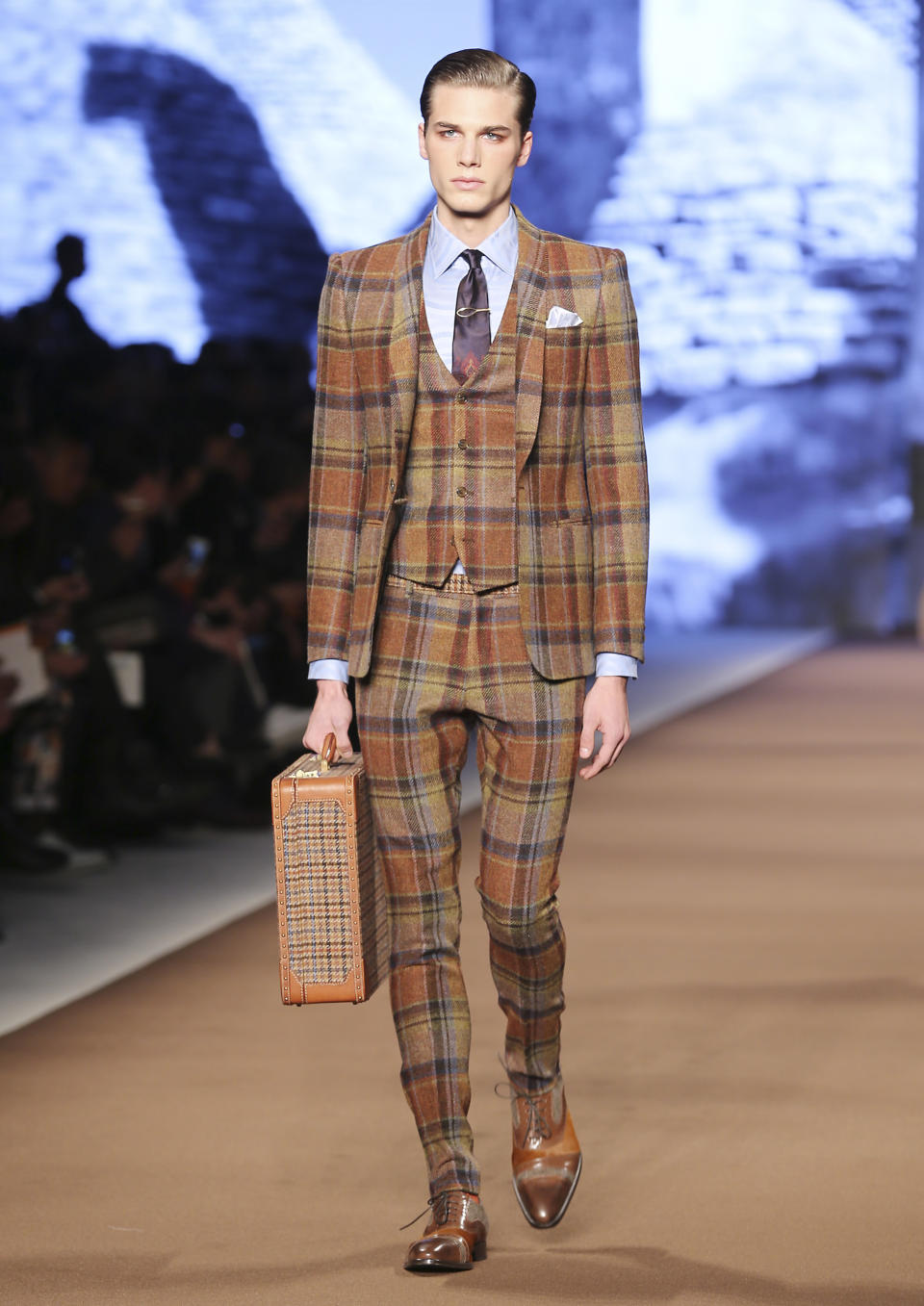 A model wears a creation for Etro men's Fall-Winter 2014 collection, part of the Milan Fashion Week, unveiled in Milan, Italy, Monday, Jan. 13, 2014. (AP Photo/Antonio Calanni)