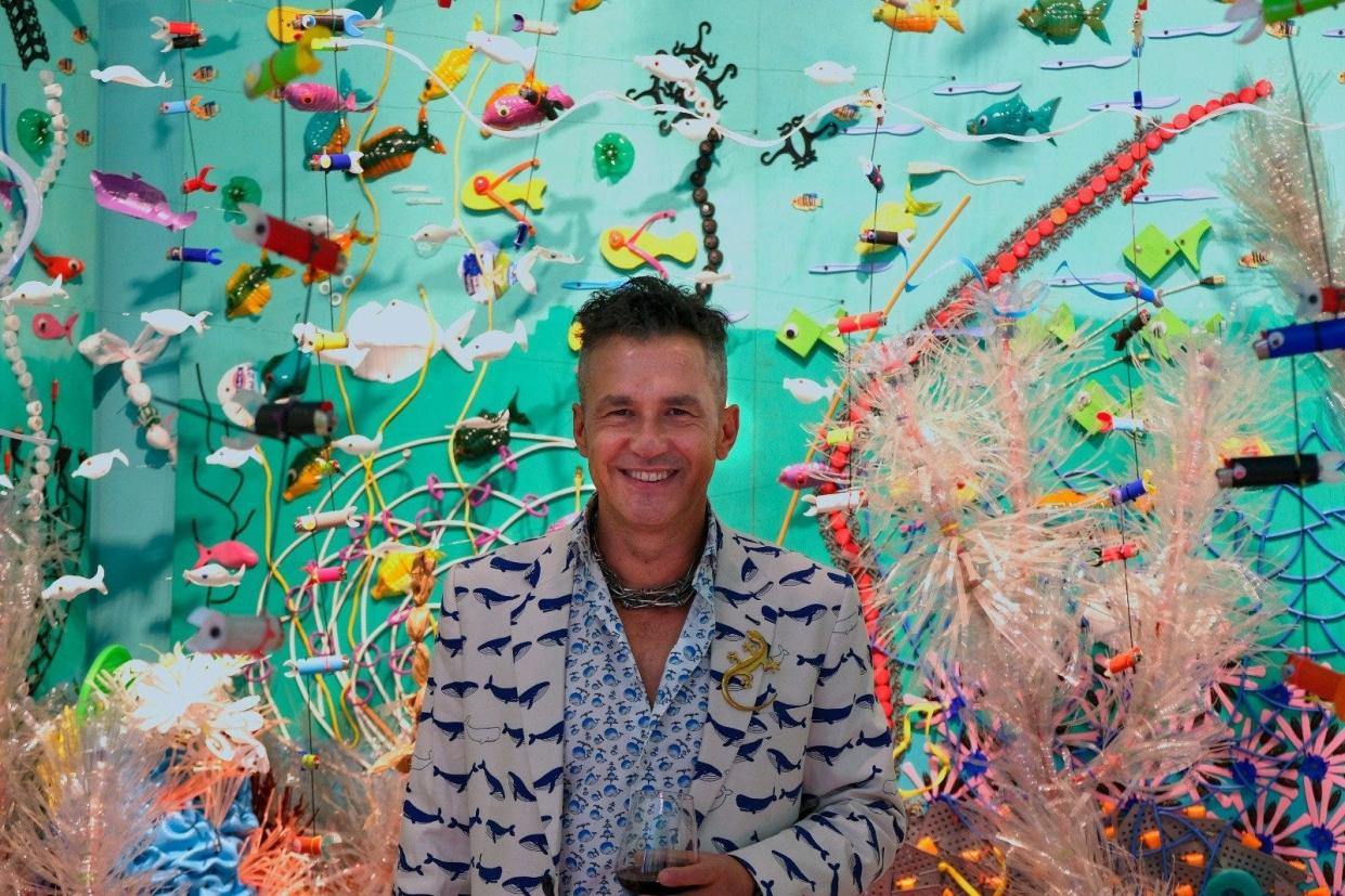 Artist Federico Uribe pictured with his "Plastic Reef." The installation is on view at the Loggerhead Marinelife Center in Juno Beach through June 9. Uribe is represented by Adelson Galleries.