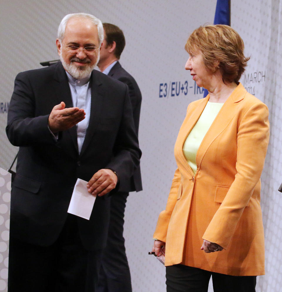 European foreign policy chief Catherine Ashton, left, and Iranian Foreign Minister Mohamad Javad Zarif, right, leave a news conference after closed-door nuclear talks in Vienna, Austria, Wednesday, March 19, 2014. They said the talks addressed Iran's uranium enrichment program, a nearly finished nuclear reactor and the lifting of sanctions on Iran that have been imposed successively over the past decade as Tehran expanded its atomic activities. The talks will resume April 7 in Vienna. (AP Photo/Ronald Zak)