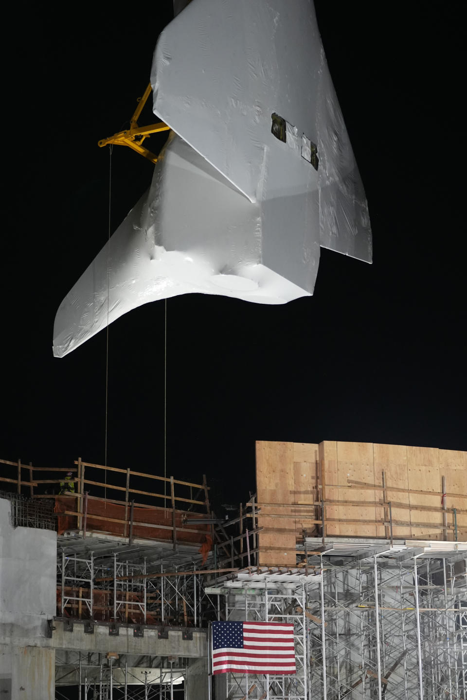 Space Shuttle Endeavour is lifted into the site of the future Samuel Oschin Air and Space Center on Tuesday, Jan. 30, 2024, in Los Angeles. (AP Photo/Ashley Landis)