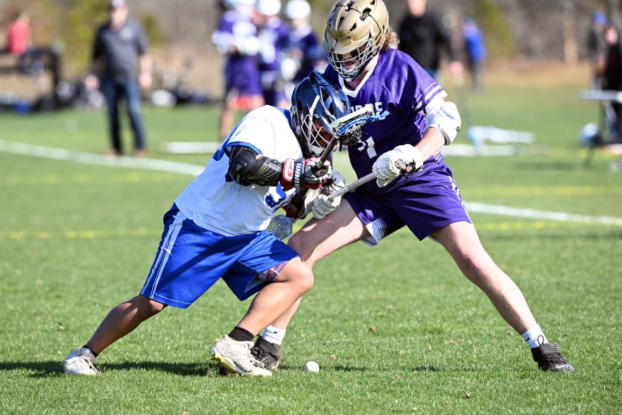 Giovanni Pandiscio of Upper Cape Tech attempts to push Brett Lucier of Bourne off the ball.