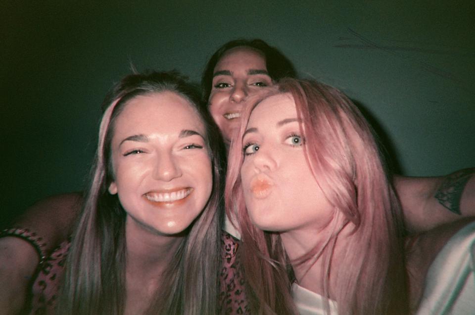 three girls pose for a selfie