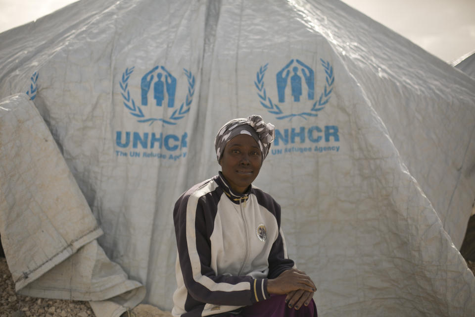 In this March 31, 2019, photo, Gailon Lawson, from Trinidad and Tobago, poses for a portrait at Al-Hol camp in Hassakeh province, Syria. Lawson said she began to regret her decision even before she reached the “caliphate.” The night she crossed with her then 12-year-old son and her new husband into Syria in 2014, people had to dash across in the darkness to evade Turkish border guards. “I saw people running, and that’s when I realized it was a mistake,” the 45-year-old Lawson said. (AP Photo/Maya Alleruzzo)