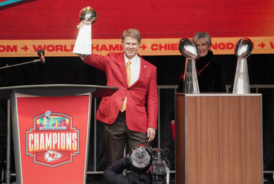 Kansas City Chiefs chairman Clark Hunt holds up the Vince Lombardi Trophy during the team's victory parade on Feb. 15, 2023.