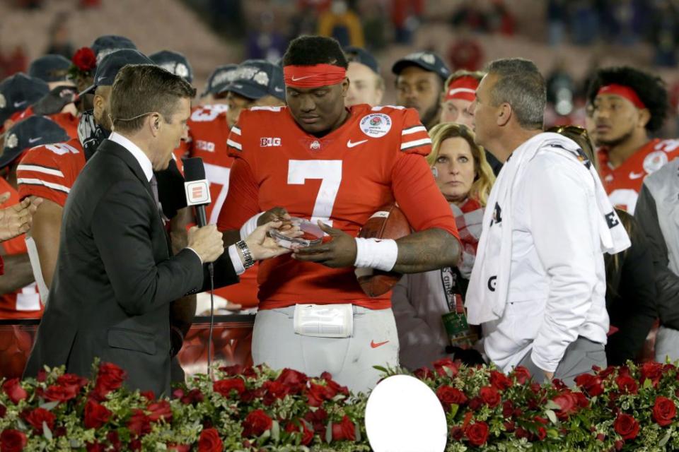PASADENA, CA - JANUARY 01:  Dwayne Haskins #7 of the Ohio State Buckeyes and Ohio State Buckeyes head coach Urban Meyer celebrate after winning the Rose Bowl Game presented by Northwestern Mutual at the Rose Bowl on January 1, 2019 in Pasadena, California.  (Photo by Jeff Gross/Getty Images)