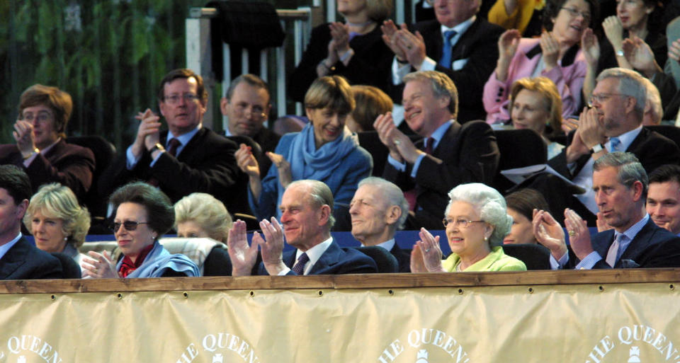 FILE - From right, Britain's Prince Charles, Queen Elizabeth II, Prince Philip, Princess Anne, and Camilla Parker-Bowles, attend the "Prom At The Palace" concert on the grounds of Buckingham Palace as part of Britain's Queen Elizabeth II Golden Jubilee celebrations, in London, Saturday, June 1, 2002, Queen Elizabeth II, Britain’s longest-reigning monarch and a rock of stability across much of a turbulent century, has died. She was 96. Buckingham Palace made the announcement in a statement on Thursday Sept. 8, 2022. (AP Photo/Alastar Grant, Pool)