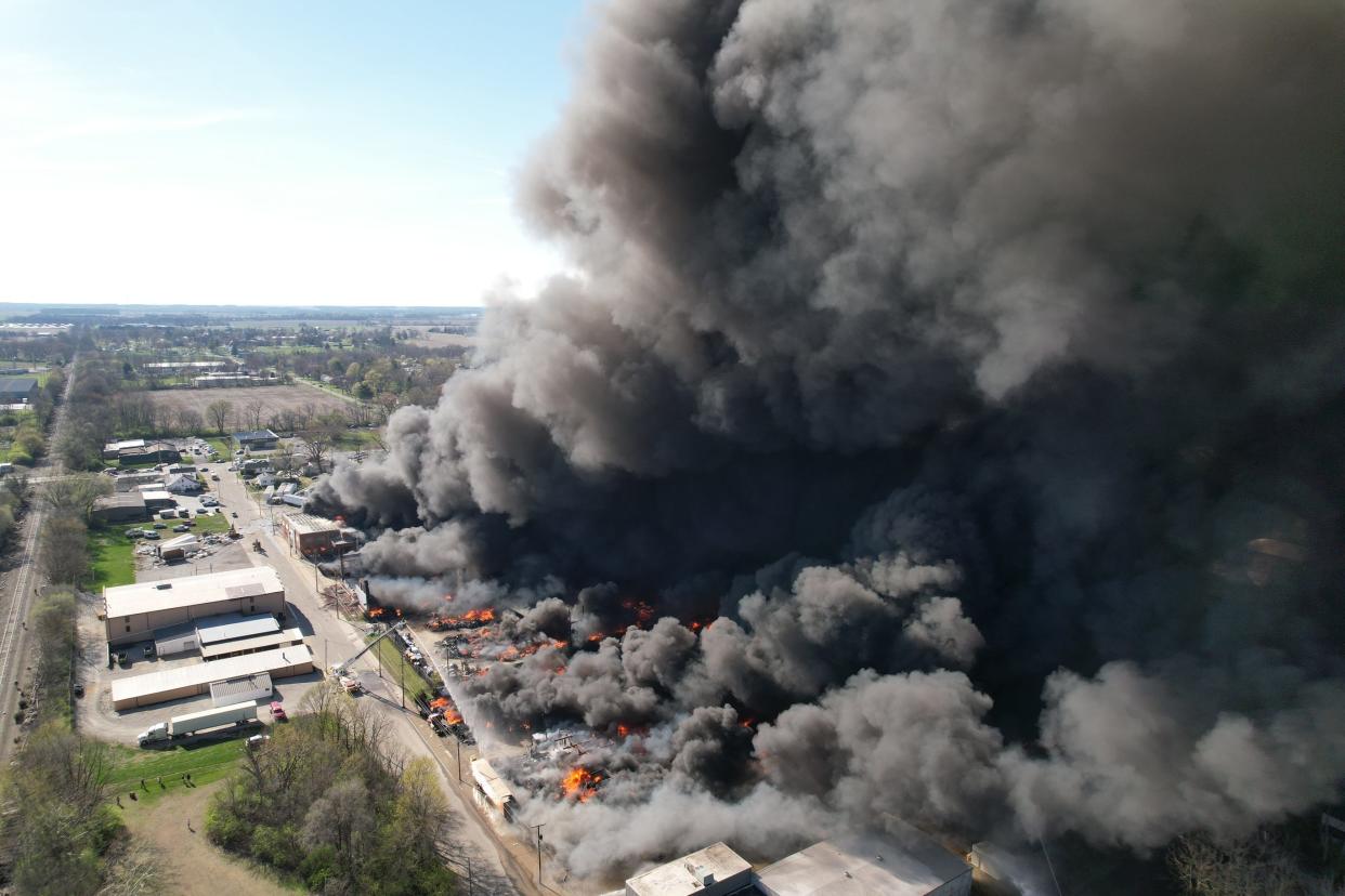 Smoke rises from an industrial fire April 11, 2023, at 358 NW F St. in Richmond.