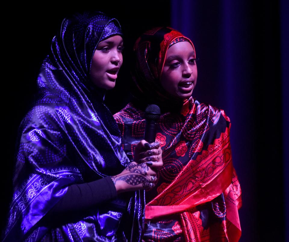 Licking Heights students Hubbi Yusuf and Samira Jama recite the poem "Settling the Somali Language' by Maxamed Ibraahin Warsame 'Hadraawi' in both English and Somali during Licking Heights High School's "Diaspora Cultural Show" on Feb. 19, 2022. The show returns and will be held Feb. 25