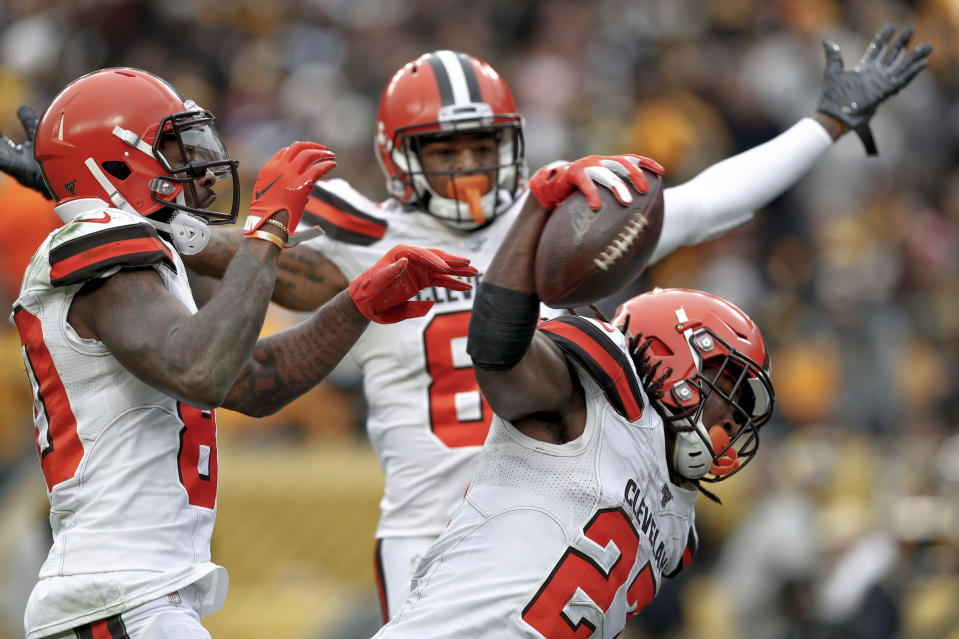 Cleveland Browns running back Kareem Hunt (27) celebrates after scoring a touchdown against the Pittsburgh Steelers in the first half of an NFL football, Sunday, Dec. 1, 2019, in Pittsburgh. (AP Photo/Don Wright)