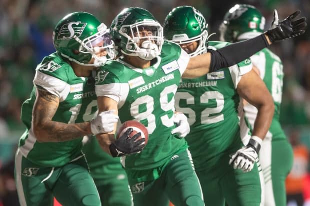 Saskatchewan Roughriders wide receiver Kian Schaffer-Baker celebrates his first CFL touchdown against the Toronto Argonauts last Friday night.  (The Canadian Press - image credit)