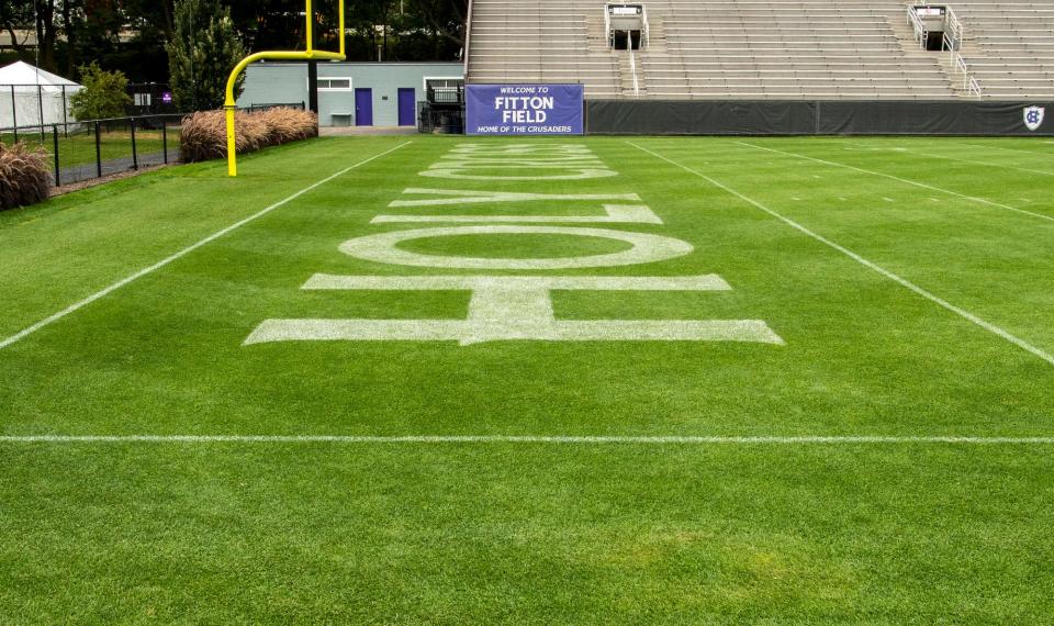 The Fitton Field turf is especially green this fall for the Holy Cross football team.