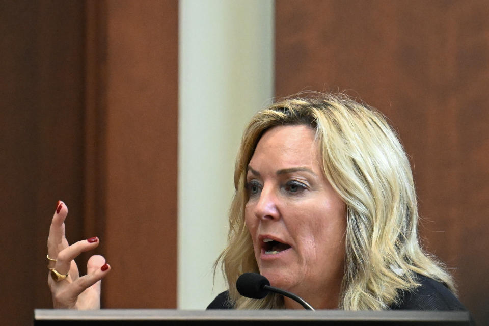 Forensic psychologist Dr. Dawn Hughes testifies as the first defense witness for actress Amber Heard at the Fairfax County Circuit Court in Fairfax, Va., Tuesday May 3, 2022. Actor Johnny Depp sued his ex-wife Amber Heard for libel in Fairfax County Circuit Court after she wrote an op-ed piece in The Washington Post in 2018 referring to herself as a "public figure representing domestic abuse." (Jim Watson/Pool photo via AP)