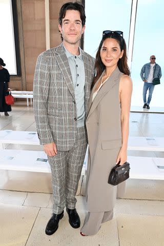 <p>Dave Benett/Getty </p> John Mulaney and Olivia Munn attend the Hermès Men spring/summer 2025 show on June 21