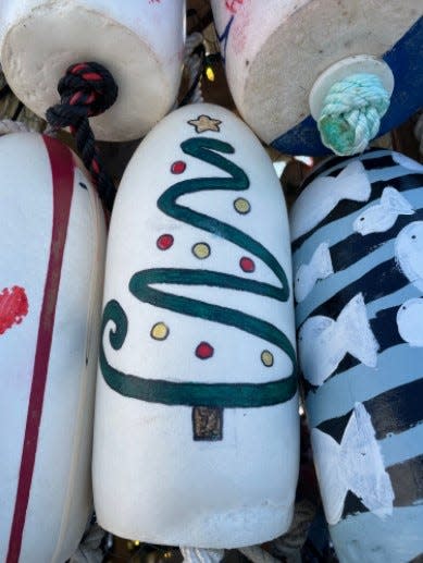 Hand-painted buoy being auctioned off to raise money for charity groups.