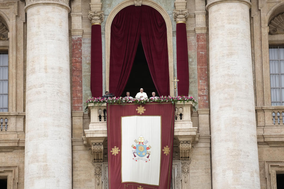 Pope Francis stands on the central balcony of the St. Peter's Basilica prior to the 'Urbi et Orbi' (To the city and to the world) blessing, at the Vatican, Sunday, March 31, 2024. (AP Photo/Andrew Medichini)