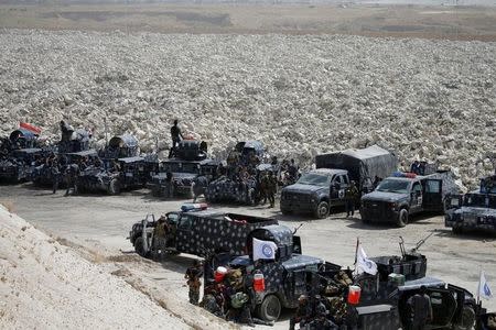 Iraqi security forces gather near Falluja, Iraq, May 24, 2016. REUTERS/Thaier Al-Sudani