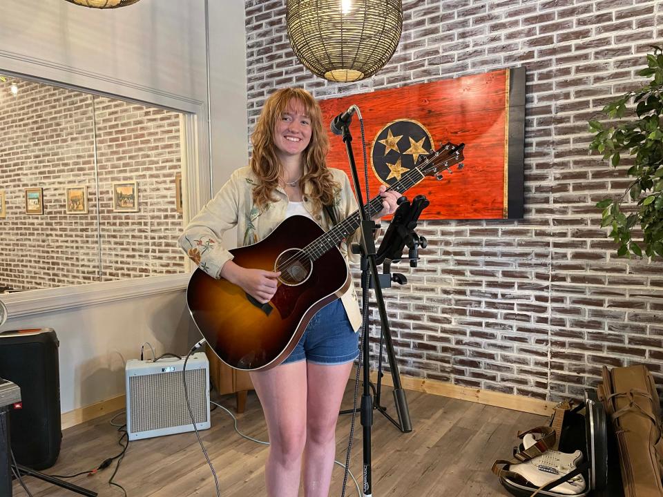 Collette Jadyn, 18, a member of Common Interest Band, plays at the grand opening of Sunago Coffee Company on 10736 Hardin Valley Road Monday, Aug. 1, 2022.