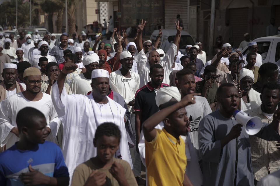 People protest in Khartoum, Sudan, after a military coup earlier this week, Friday, Oct. 29, 2021. The coup threatens to halt Sudan's fitful transition to democracy, which began after the 2019 ouster of long-time ruler Omar al-Bashir and his Islamist government in a popular uprising. It came after weeks of mounting tensions between military and civilian leaders over the course and pace of that process. (AP Photo / Marwan Ali)