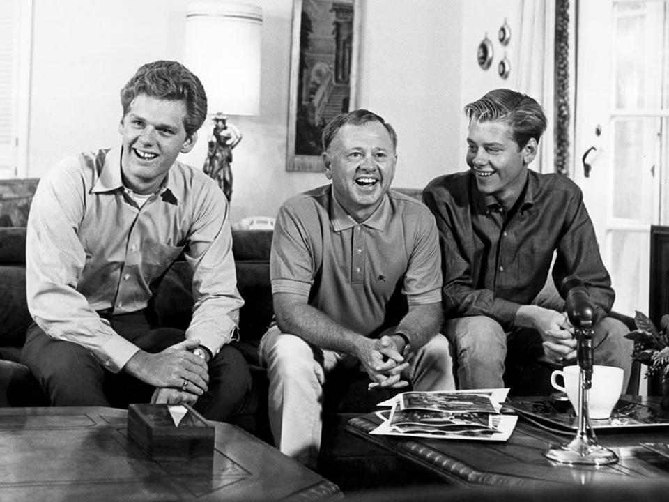 Mickey Rooney at his home in Beverly Hills with his sons Mickey Rooney Jr. (left) and Tim Rooney in October 1964. - Credit: Courtesy Everett Collection