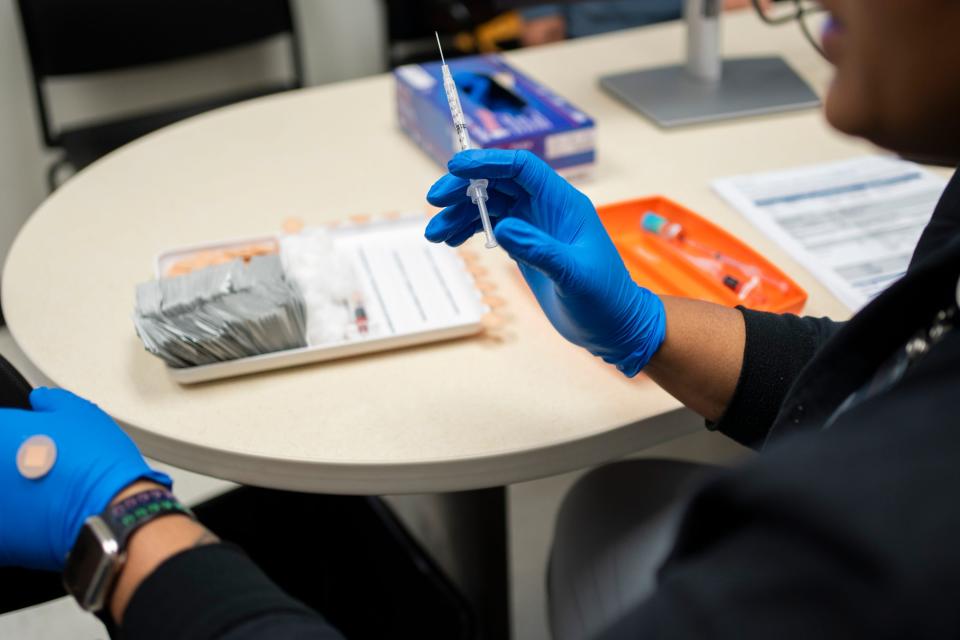 A nurse prepares to administer a flu shot last week in Columbus, Ohio.