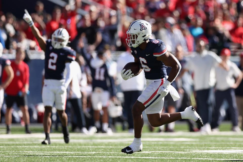 Arizona Wildcats running back Michael Wiley rushes the football during a game on Nov. 25, 2022, in Tucson, Arizona. The NCAA is hinting that it might want to get into the sports gambling game.