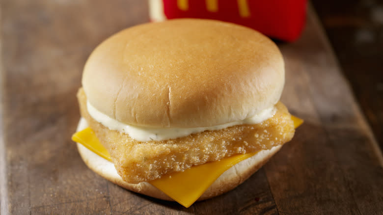 mcdonalds filet-o-fish on wooden counter