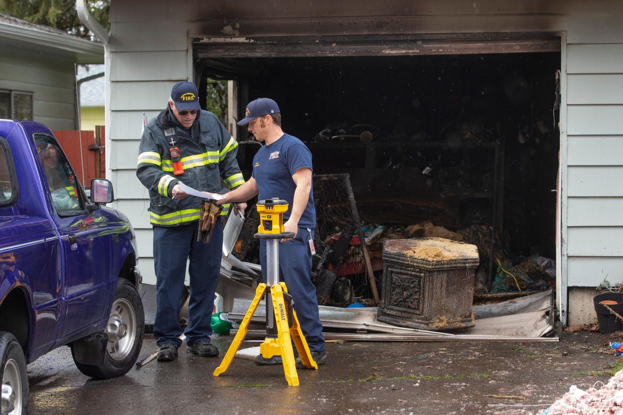 Eugene Springfield Fire Marshals investigate a fire at a home on H Street in Springfield April 4, 2023.