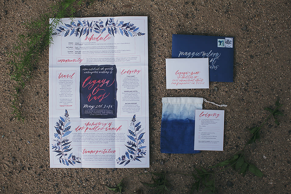 The couple’s navy and coral wedding invitation, designed by Zargosy.