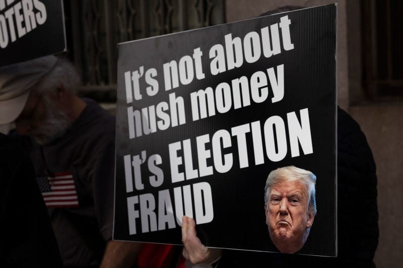 Anti-Trump protesters with the activist group Rise & Resist hold signs and banners outside the Manhattan Criminal Courthouse. Jury selection begins on 15 April for People of the State of New York v. Donald Trump, known as the Stormy Daniels hush money case, charging that the former President orchestrated a cover-up of payments to Stephanie Clifford (the adult film actress known as Stormy Daniels,) as a means to interfere with the 2016 presidential election. Gina M Randazzo/ZUMA Press Wire/dpa