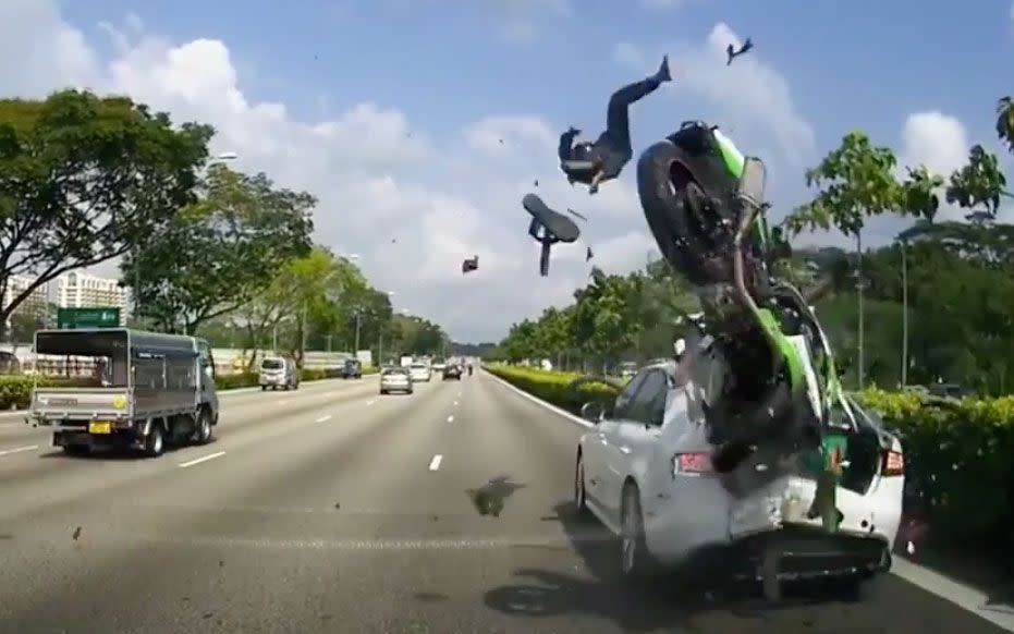 The motorbike's pillion rider flies into the air after the crash. Source: Facebook