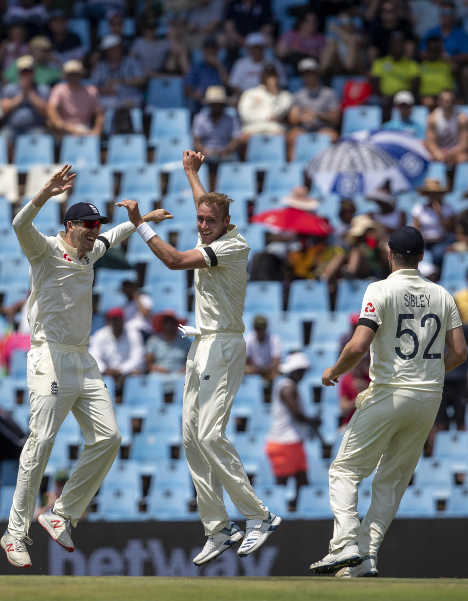 England's bowler Stuart Broad, center, celebrates with teammate after dismissing South Africa's captain Faf du Plessis for 29 runs on day one of the first cricket test match between South Africa and England at Centurion Park, Pretoria, South Africa, Thursday, Dec. 26, 2019. (AP Photo/Themba Hadebe)