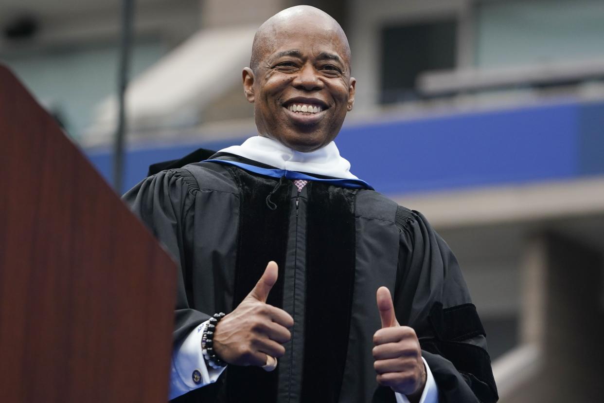 New York City Mayor Adams gives a thumbs-up after receiving an honorary degree during a graduation ceremony for Pace University at the USTA Billie Jean King Tennis Center in Flushing, Queens, New York on Monday, May 16, 2022. 