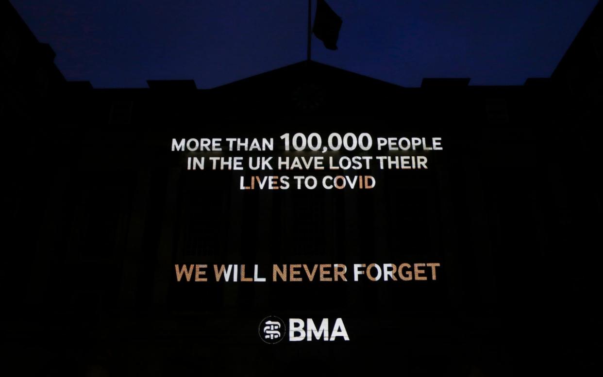 A projection commemorating the lives lost to Covid-19 is displayed on BMA House - Hollie Adams/Getty Images