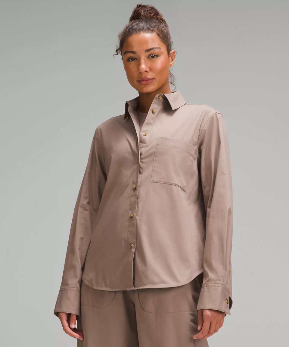 someone wearing the lululemon Relaxed-Fit Cotton-Blend Poplin Button-Down Shirt