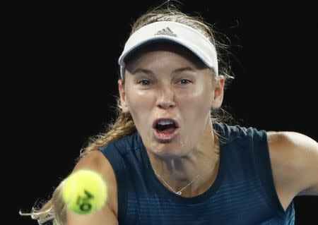 Tennis - Australian Open - Third Round - Melbourne Park, Melbourne, Australia, January 18, 2019. Denmark's Caroline Wozniacki reacts during the match against Russia's Maria Sharapova. REUTERS/Aly Song