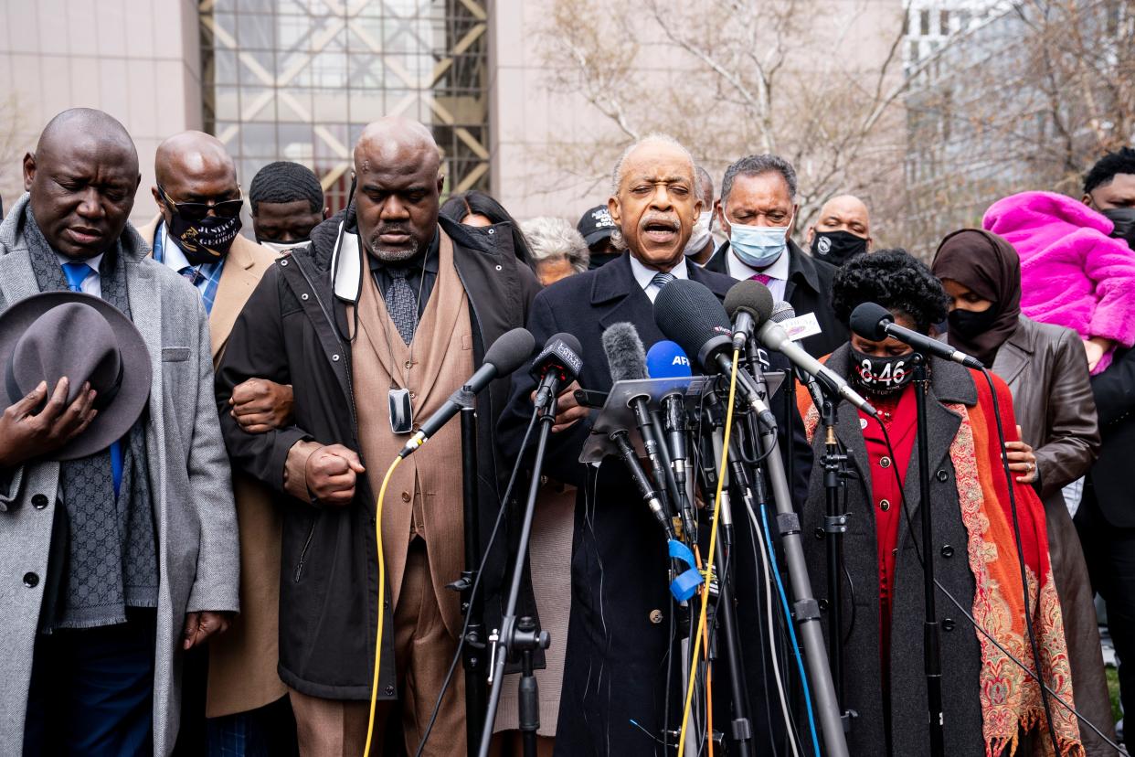 Rev. Al Sharpton, center right, leads a prayer alongside Rodney Floyd, brother of George Floyd, center left, during a news conference outside the Hennepin County Government Center before the murder trial against the former Minneapolis police officer Derek Chauvin in the killing of George Floyd, Monday, April 19, in Minneapolis. 