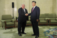 FILE - Samoa Prime Minister Tuilaepa Lupesoliai Sailele Malielegaoi, left, shakes hands with Chinese President Xi Jinping at the Great Hall Of The People Tuesday, Sept. 18, 2018, in Beijing. China wants 10 small Pacific nations to endorse a sweeping agreement covering everything from security to fisheries in what one leader warns is a “game-changing” bid by Beijing to wrest control of the region. (Lintao Zhang/Pool Photo via AP, File)