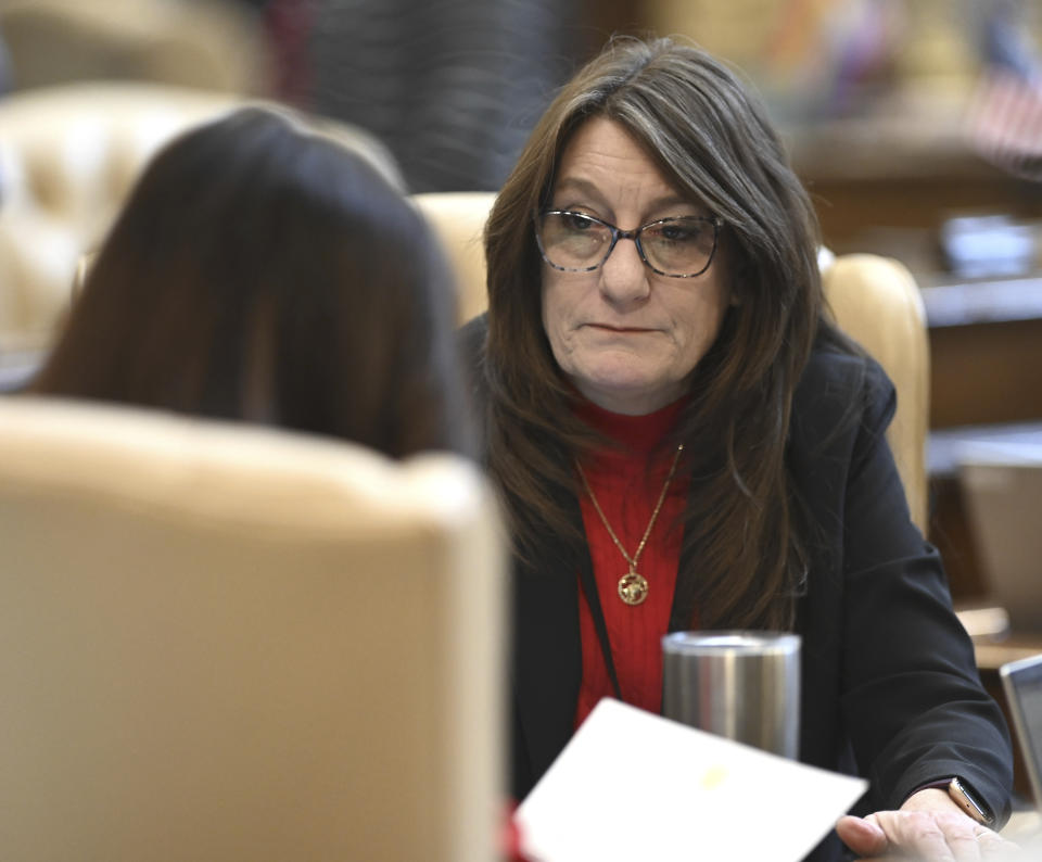 Michigan Senators Dayna Polehanki, left, and Veronica Klinefelt talk at the Capitol in Lansing, as a Right To Work bill is voted on, Tuesday, March 14, 2023. A Michigan Senate committee voted Tuesday morning to advance bills that would represent landmark victories for labor unions by repealing the 2012 right-to-work law and re-establishing a prevailing wage standard for state projects. (Todd McInturf/Detroit News via AP)