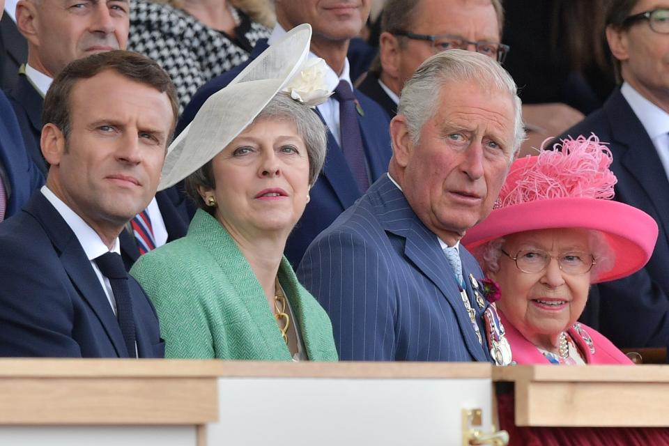 (L-R) French President Emmanuel Macron, Britain's Prime Minister Theresa May, Britain's Prince Charles, Prince of Wales and Britain's Queen Elizabeth II attend an event to commemorate the 75th anniversary of the D-Day landings, in Portsmouth, southern England, on June 5, 2019. - US President Donald Trump, Queen Elizabeth II and 300 veterans are to gather on the south coast of England on Wednesday for a poignant ceremony marking the 75th anniversary of D-Day. Other world leaders will join them in Portsmouth for Britain's national event to commemorate the Allied invasion of the Normandy beaches in France -- one of the turning points of World War II. (Photo by Daniel LEAL-OLIVAS / AFP)        (Photo credit should read DANIEL LEAL-OLIVAS/AFP via Getty Images)