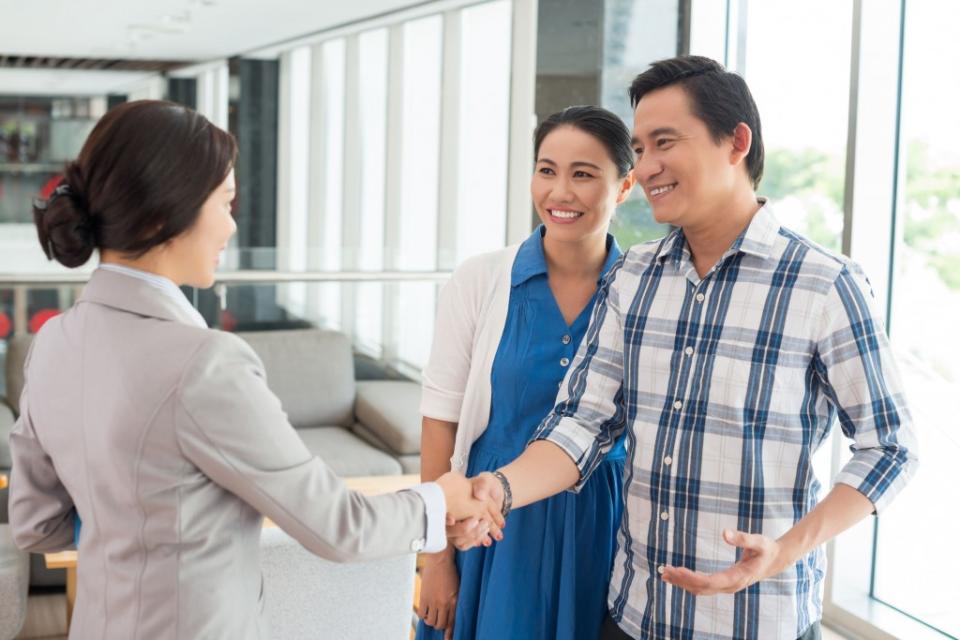 husband shaking hands with the real estate agent