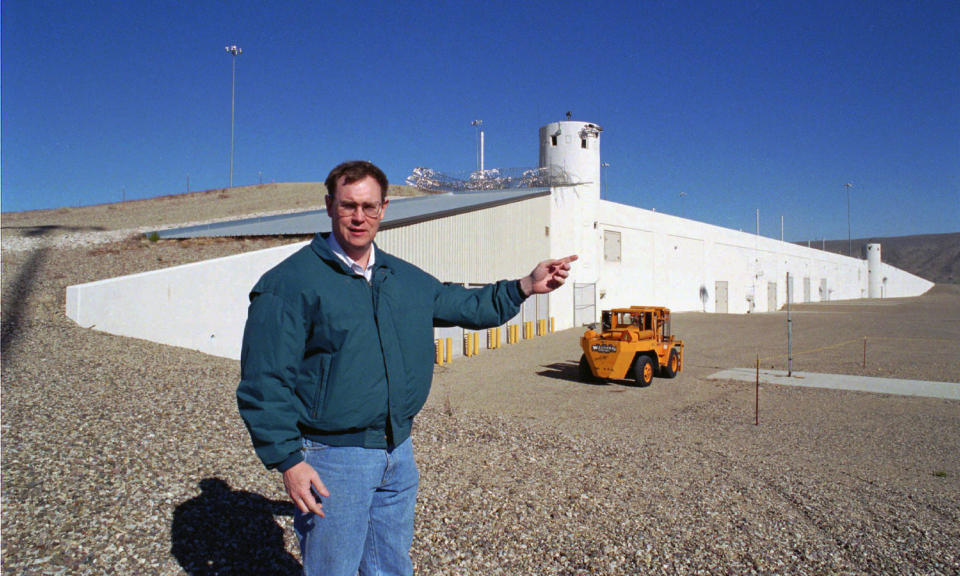 FILE - In this Feb. 18, 1997 file photo, then John McGrail, director of the Department of Energy stockpile stewardship program, talks about the $100 million Device Assembly Facility behind him at the Nevada Test Site in Mercury, Nev. Nevada's U.S. senators and Energy Secretary Rick Perry are set to tour the site north of Las Vegas where the federal government is handling weapons-grade plutonium shipped from South Carolina. A federal appeals court has ruled against Nevada in a legal battle over the U.S. government's secret shipment of weapons-grade plutonium to a site near Las Vegas. A three-judge panel of the 9th U.S. Circuit Court of Appeals on Tuesday, Aug. 13, 2019, denied the state's appeal after a judge refused to block any future shipments to Nevada. The court in San Francisco says the matter is moot because the Energy Department already sent the radioactive material and has promised that no more will be hauled there. (AP Photo/Lennox McLendon, File)